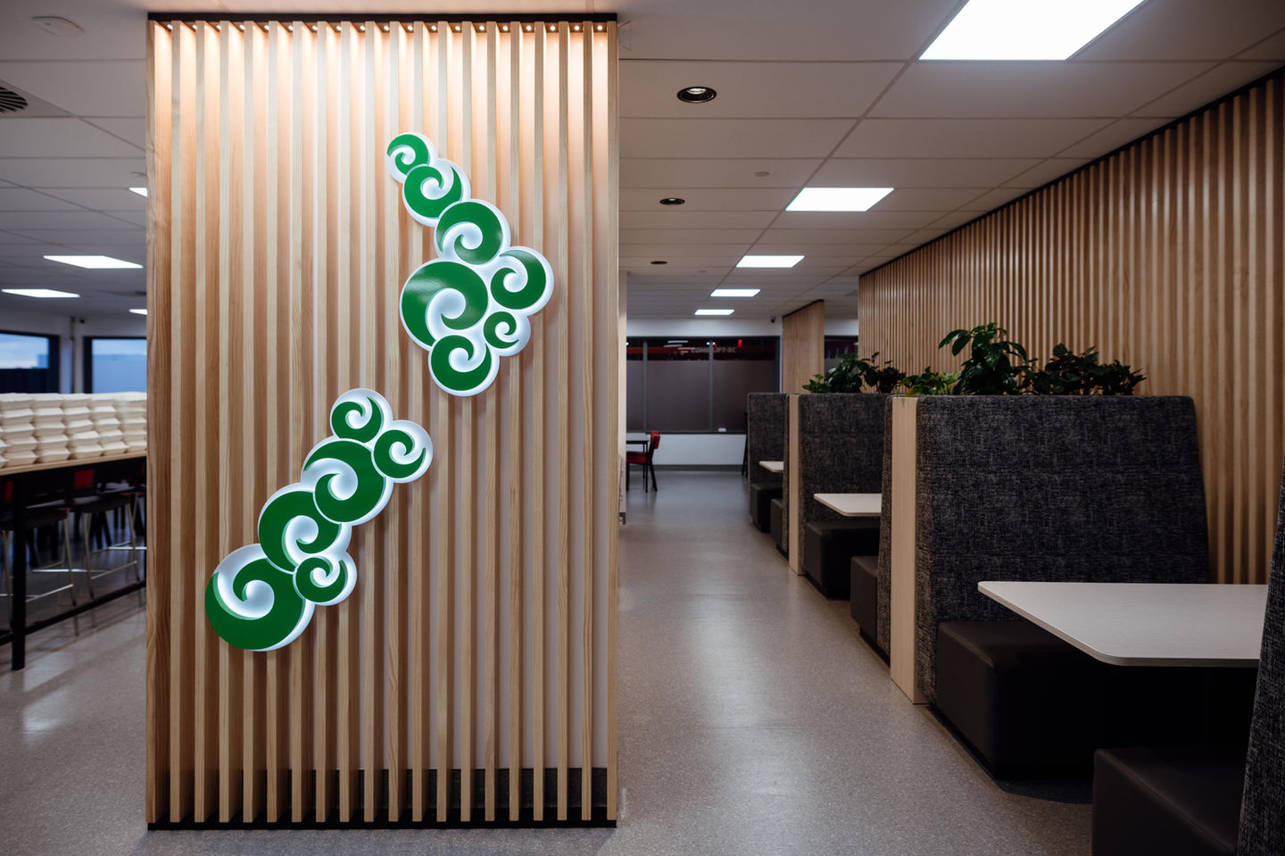 Office interior with artwork and seating areas, modern and contemporary design.